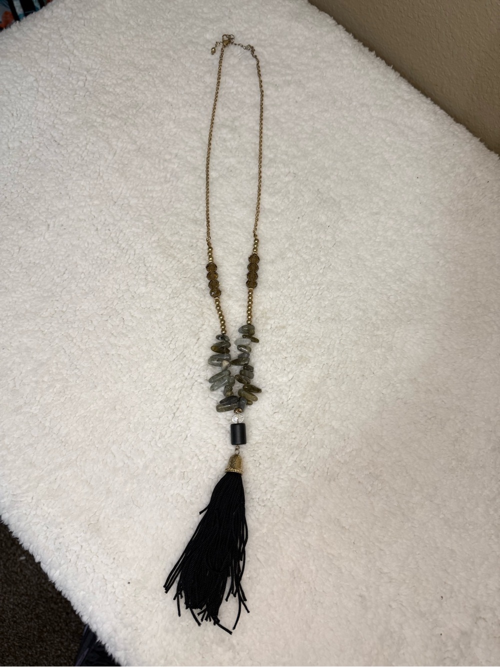 Long Gold-Tone Necklace with Green Stone Cluster and Black Tassel